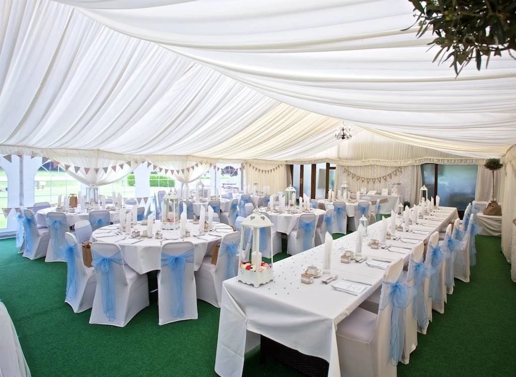 Garden Suite marquee with blue sashes for wedding and corporate gala events.
