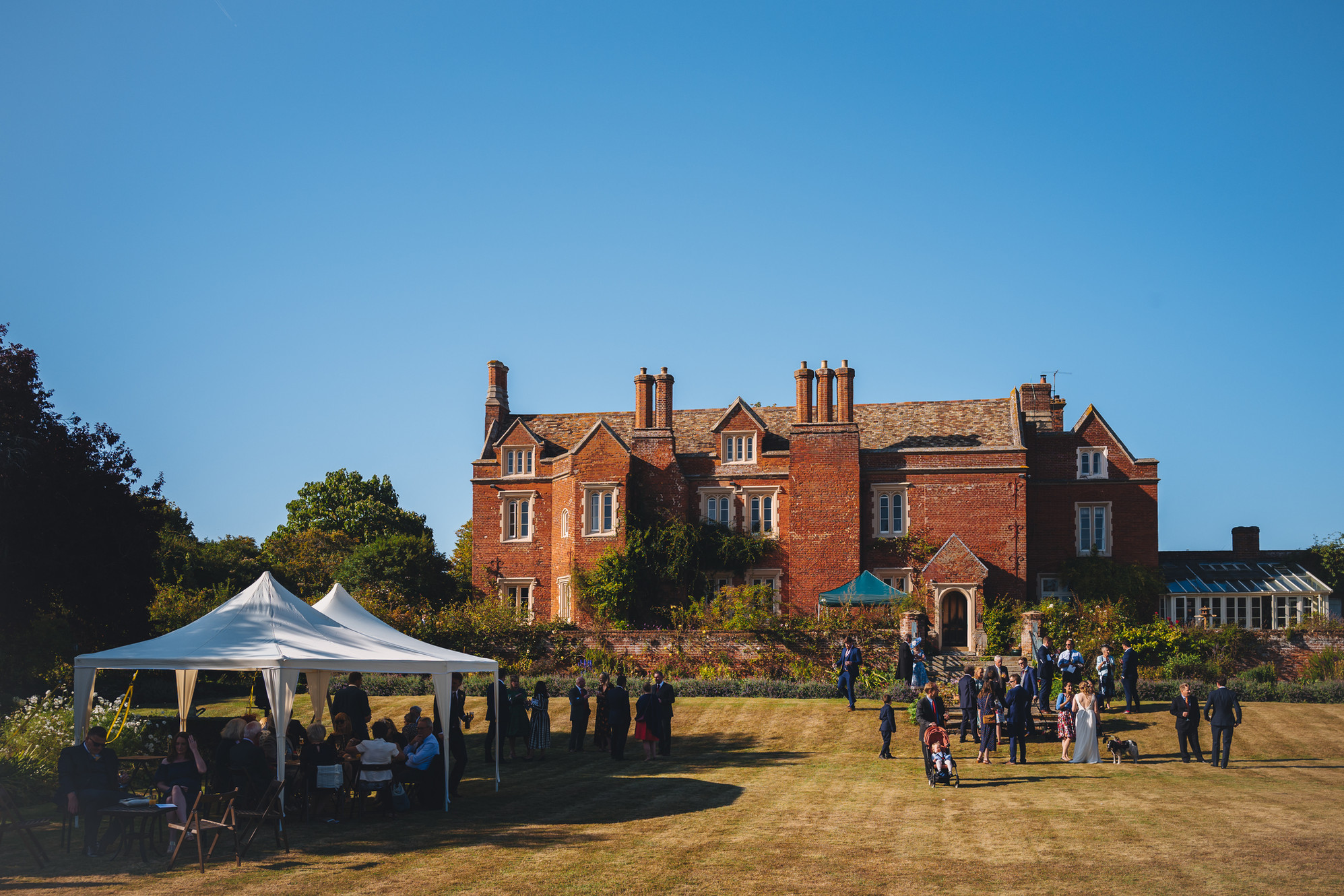 Marquee event setup in Childerley Hall courtyard, perfect for outdoor weddings and garden parties.