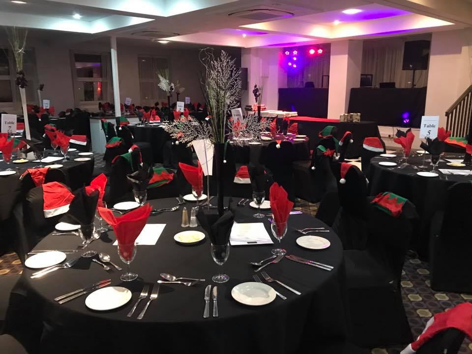 Elegant event space with festive decor, ready for gatherings or celebrations.