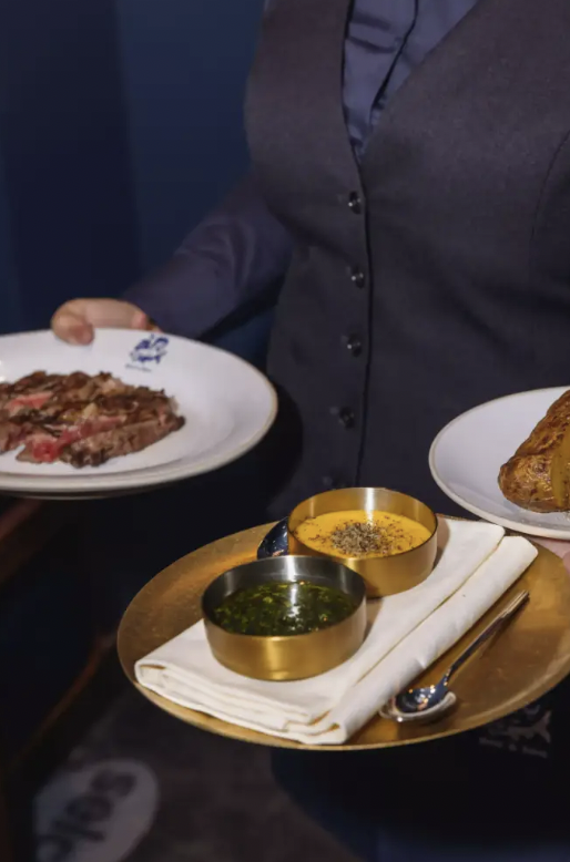 Upscale venue hire at Beef and Bass featuring exquisite culinary display.