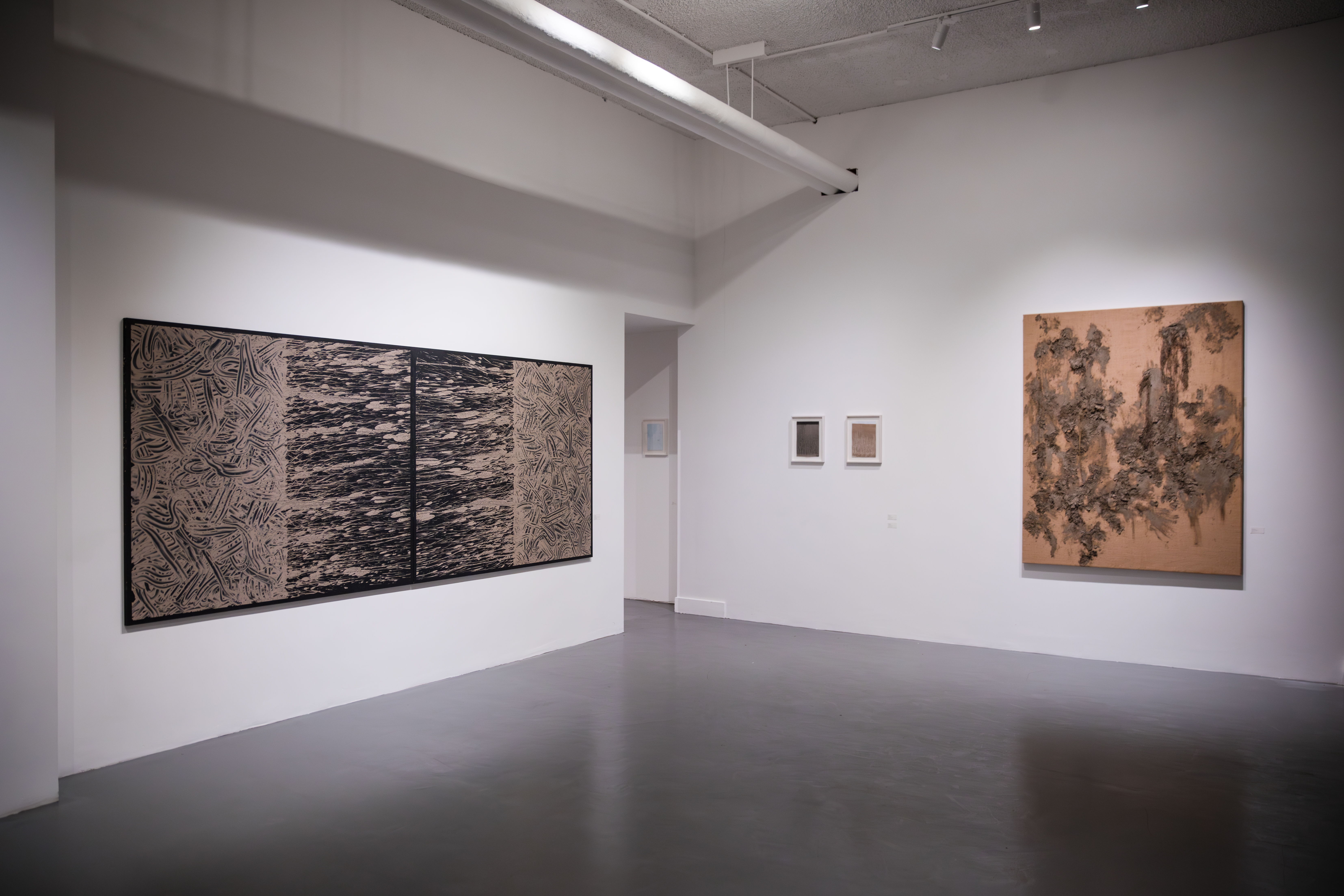 Modern art gallery with polished floor for corporate events and art gatherings.