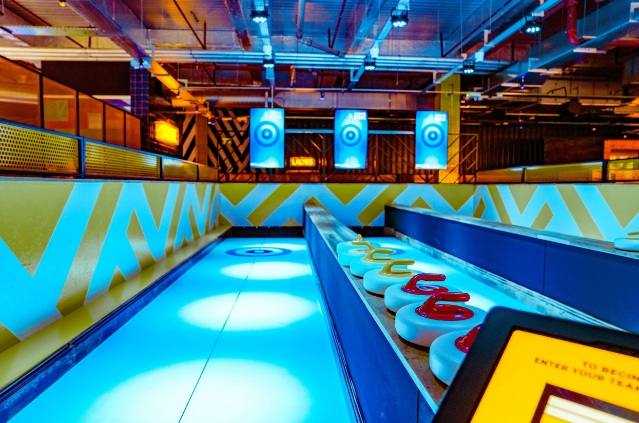 Vibrant curling area at King Pins Silverburn for team-building events and recreation.