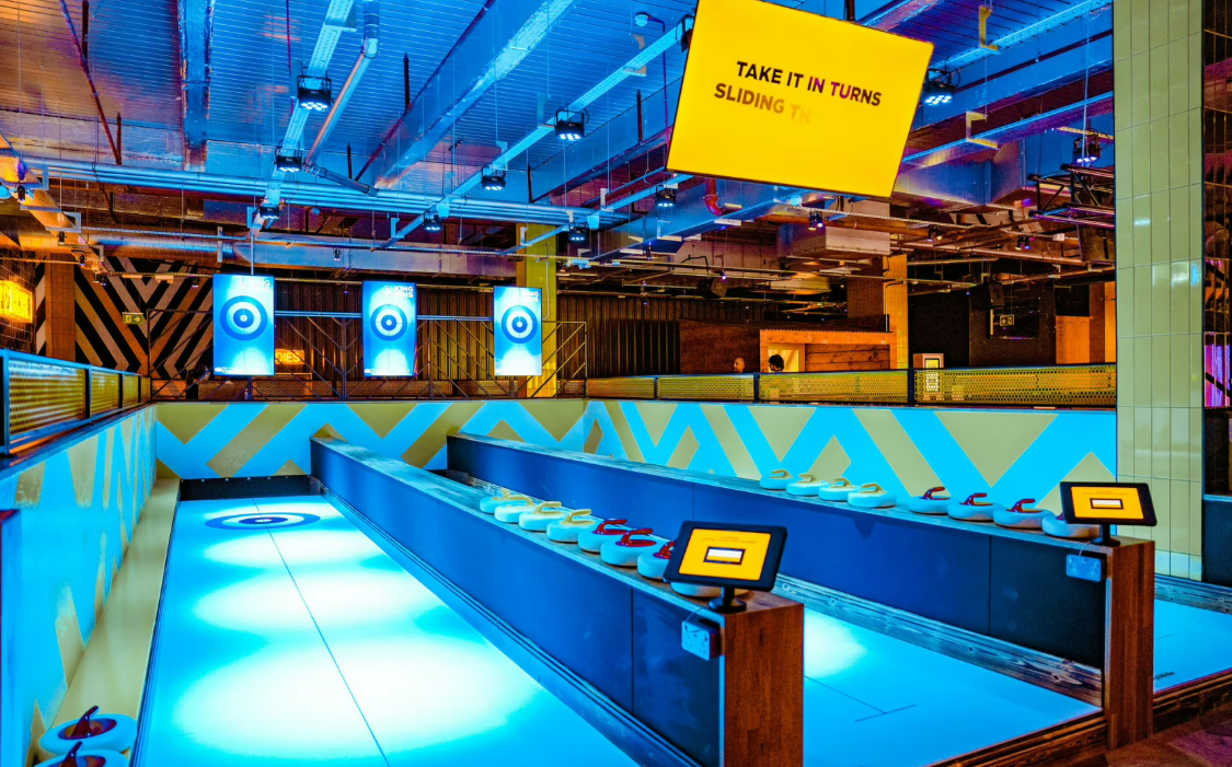 Vibrant sliding game setup at The Glide Zone, Silverburn - ideal for team-building events.