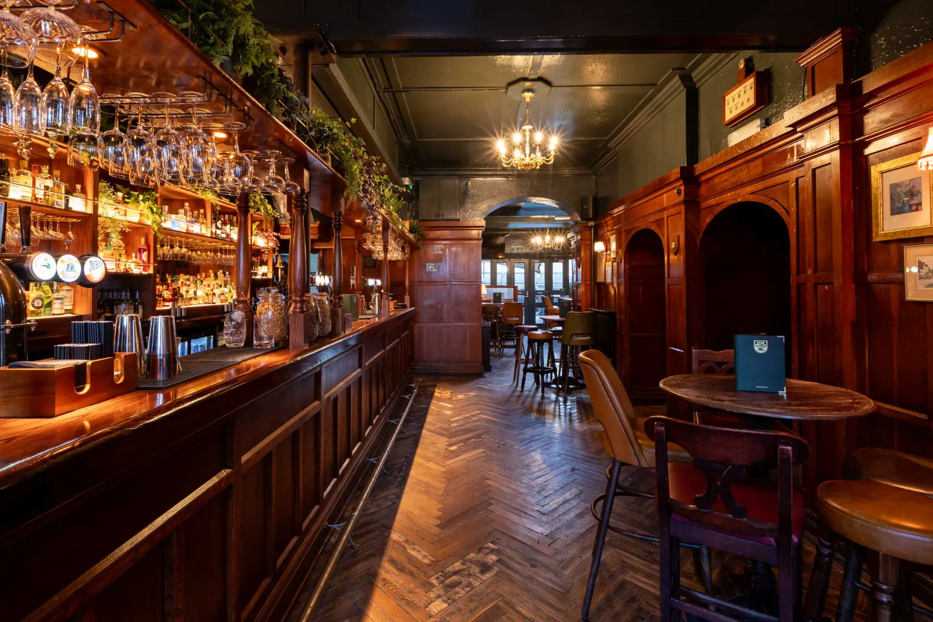 Stylish Balham Bowls Club lounge with wooden accents, perfect for networking events and gatherings.