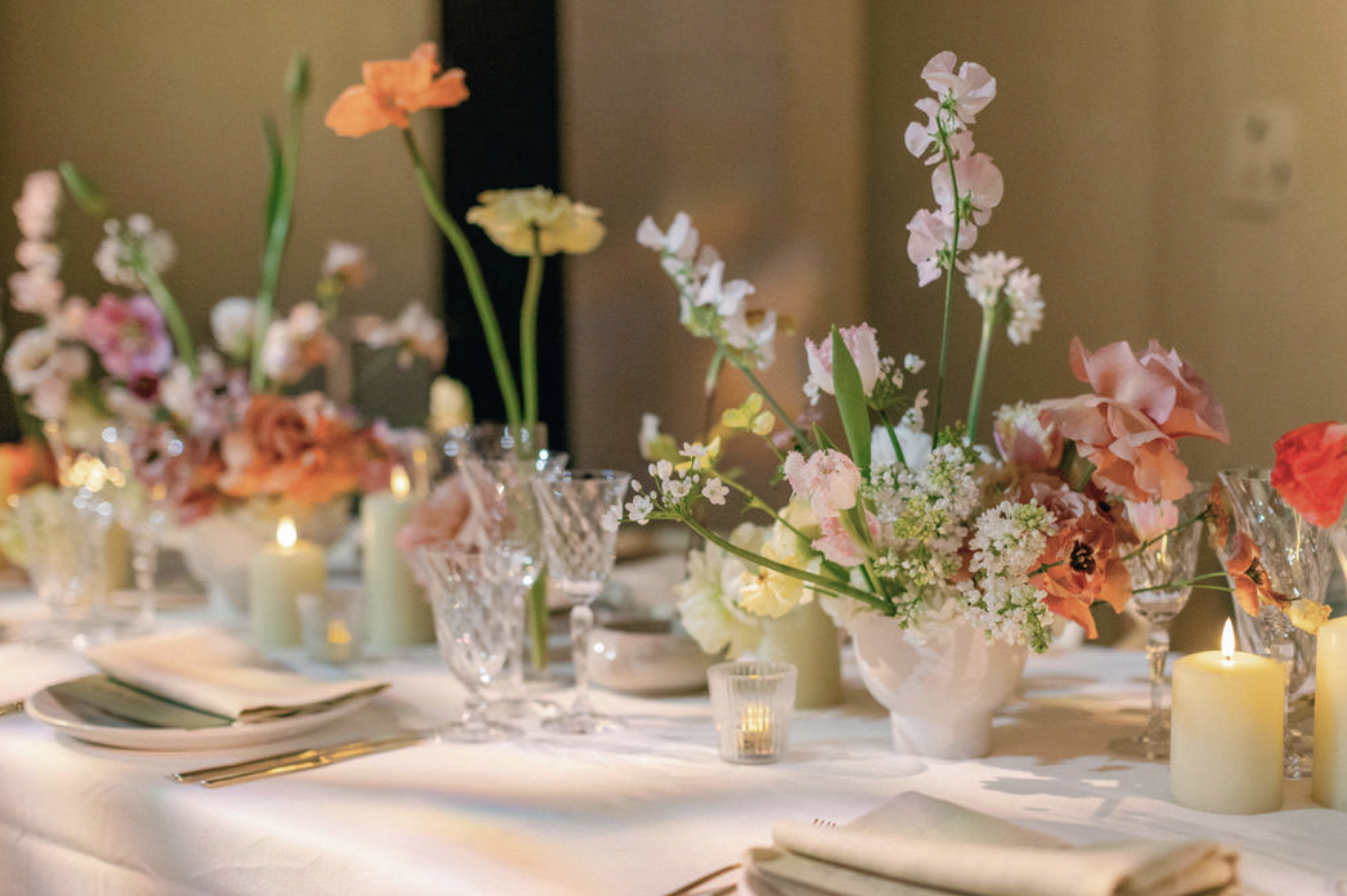 Elegant dining setup with floral centerpieces in The Great Hall, ideal for upscale events.