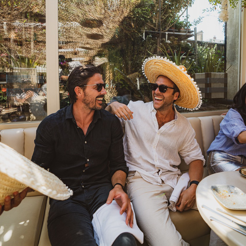"Two smiling individuals at The Terrace in Mezcalito Chelsea, perfect for networking events."