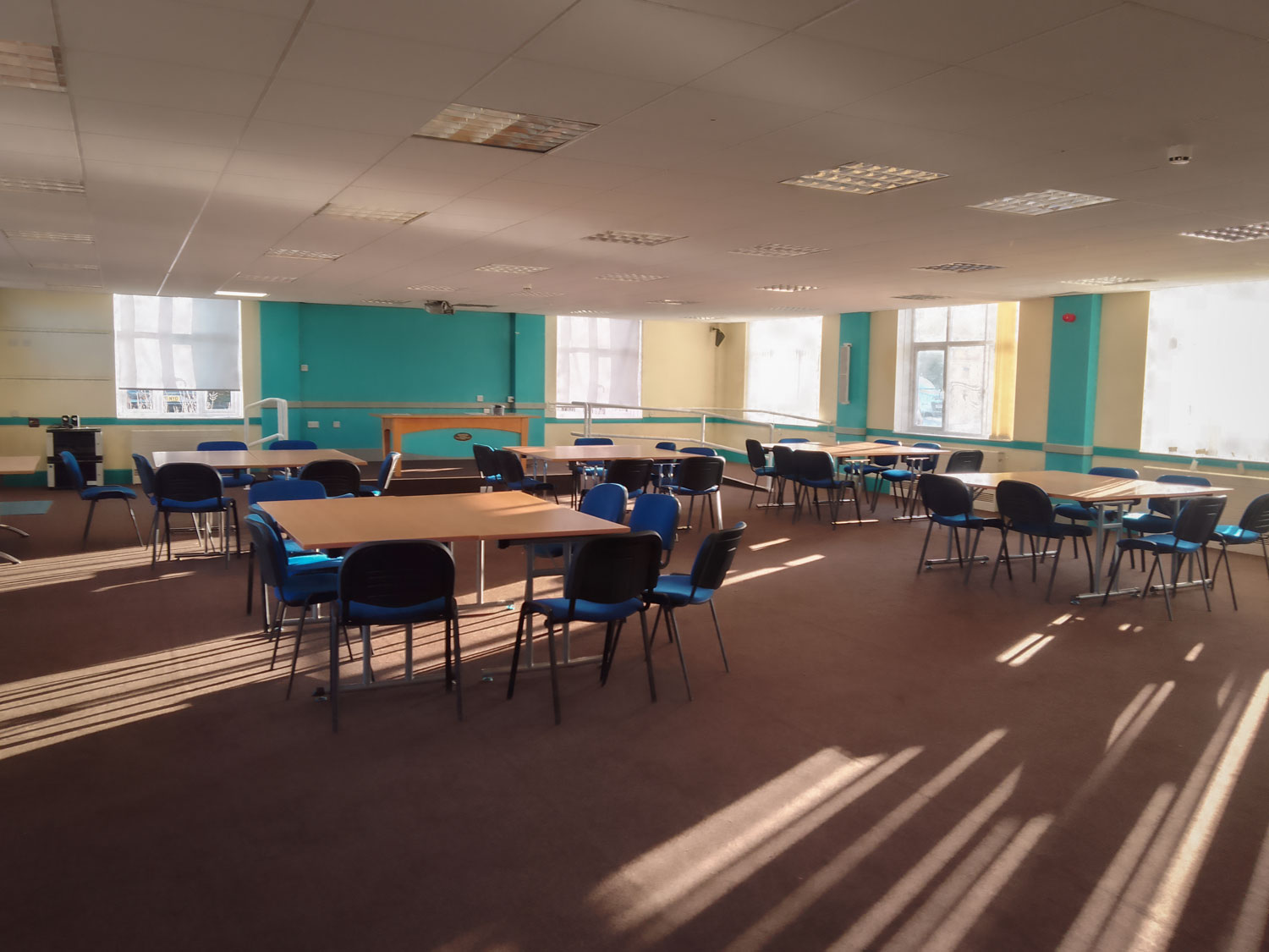 Spacious meeting room with flexible layout, ideal for collaborative workshops and sessions.