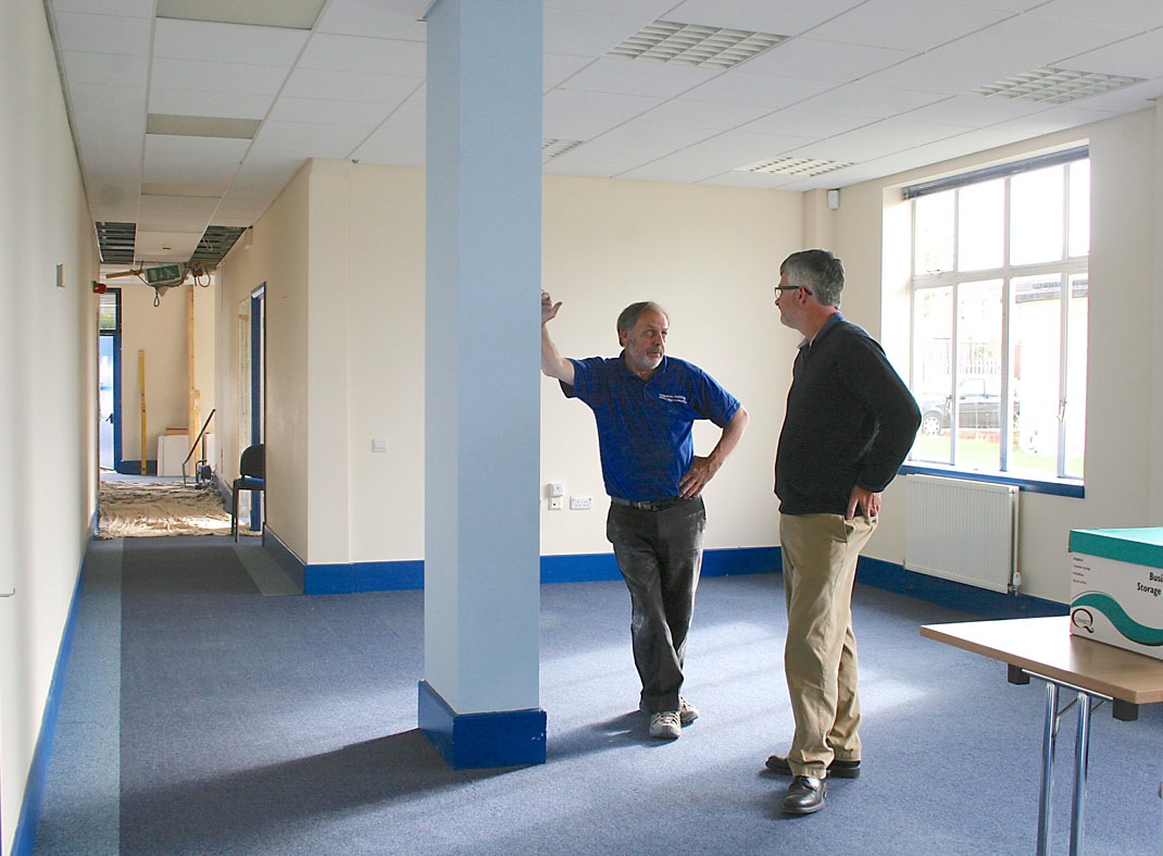Meeting room setup discussion in David Baker Room, Vassall Centre, for future events.