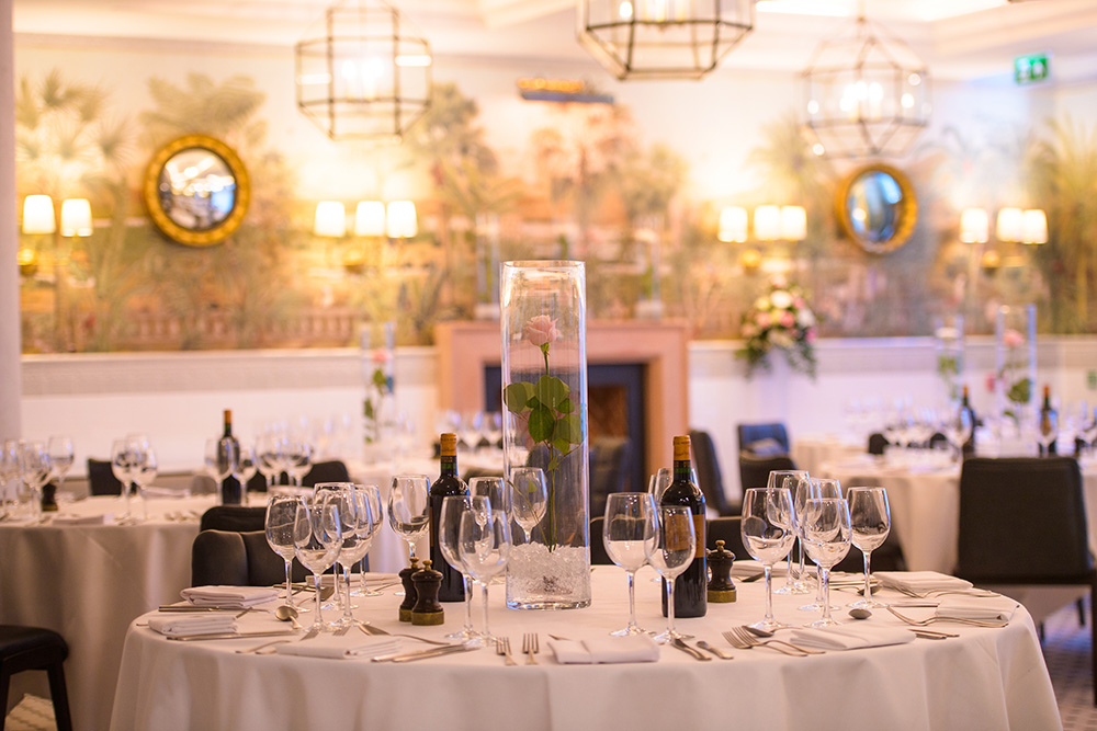Elegant gala setup at The Barn in The Punter with floral centerpieces for corporate event venue.