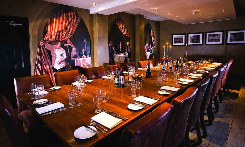 Private dining room at The Barn, featuring a polished timber table for executive corporate events.