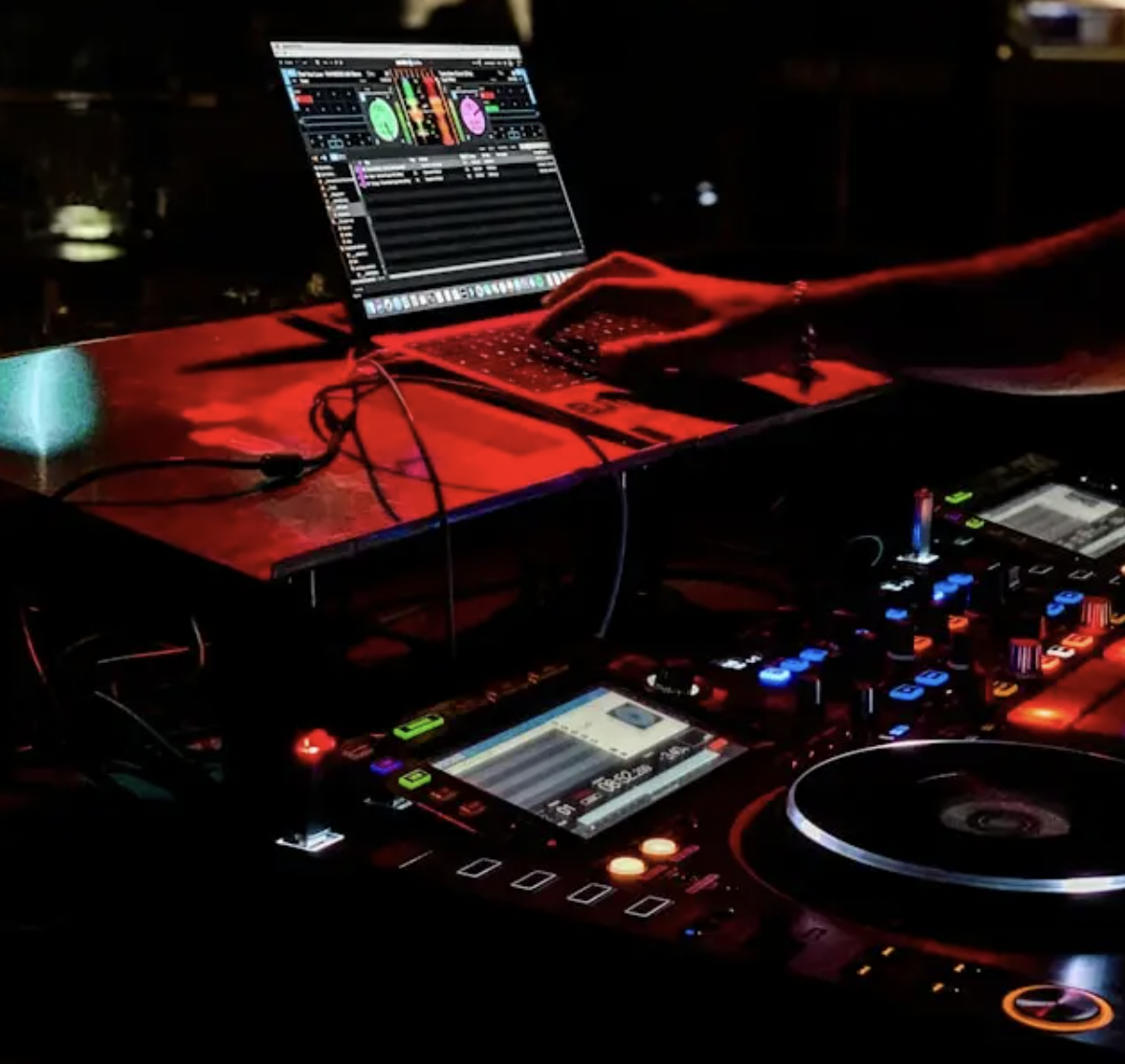 DJ setup with vibrant lighting at Venue Hire in Nova Chelsea for unforgettable events.