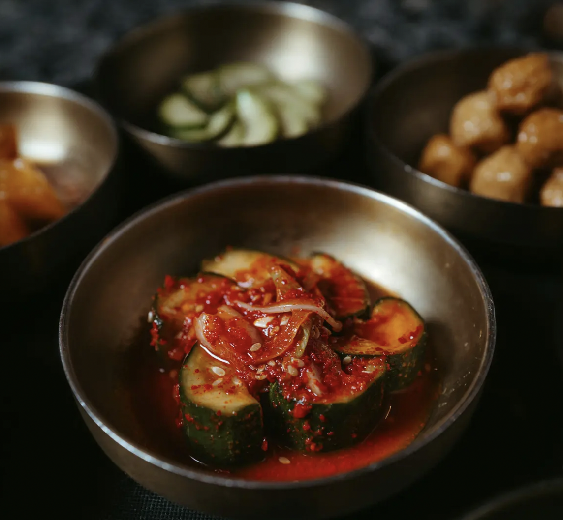 Elegant culinary dish with vibrant cucumber dressing for events and buffets at Nova Chelsea.