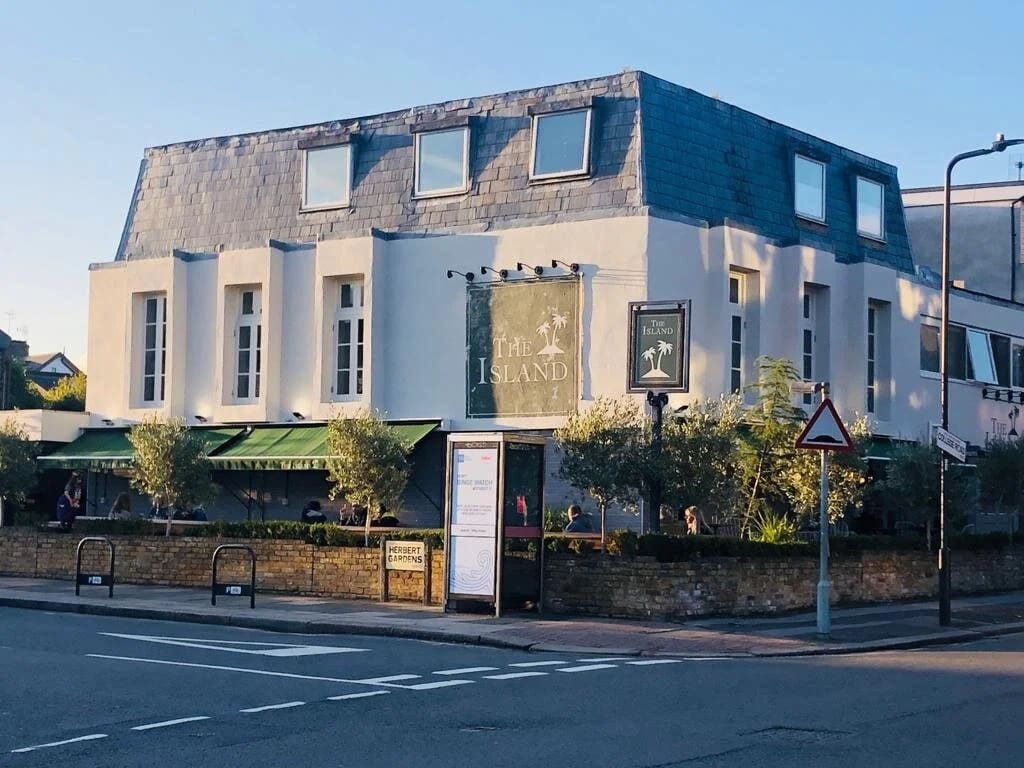 Charming venue with ample windows, ideal for corporate meetings and social events.