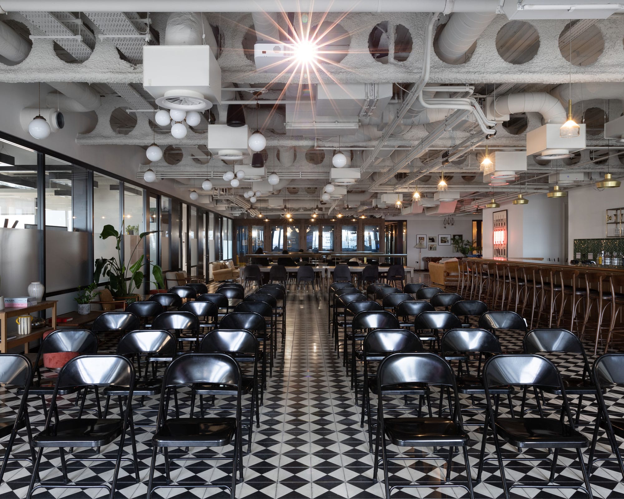 Liverpool Street Event Space with black chairs, ideal for seminars and workshops.