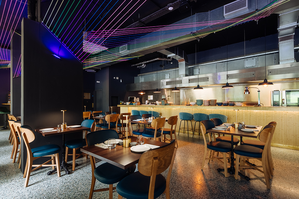Modern restaurant interior with vibrant decor, ideal for events and gatherings.