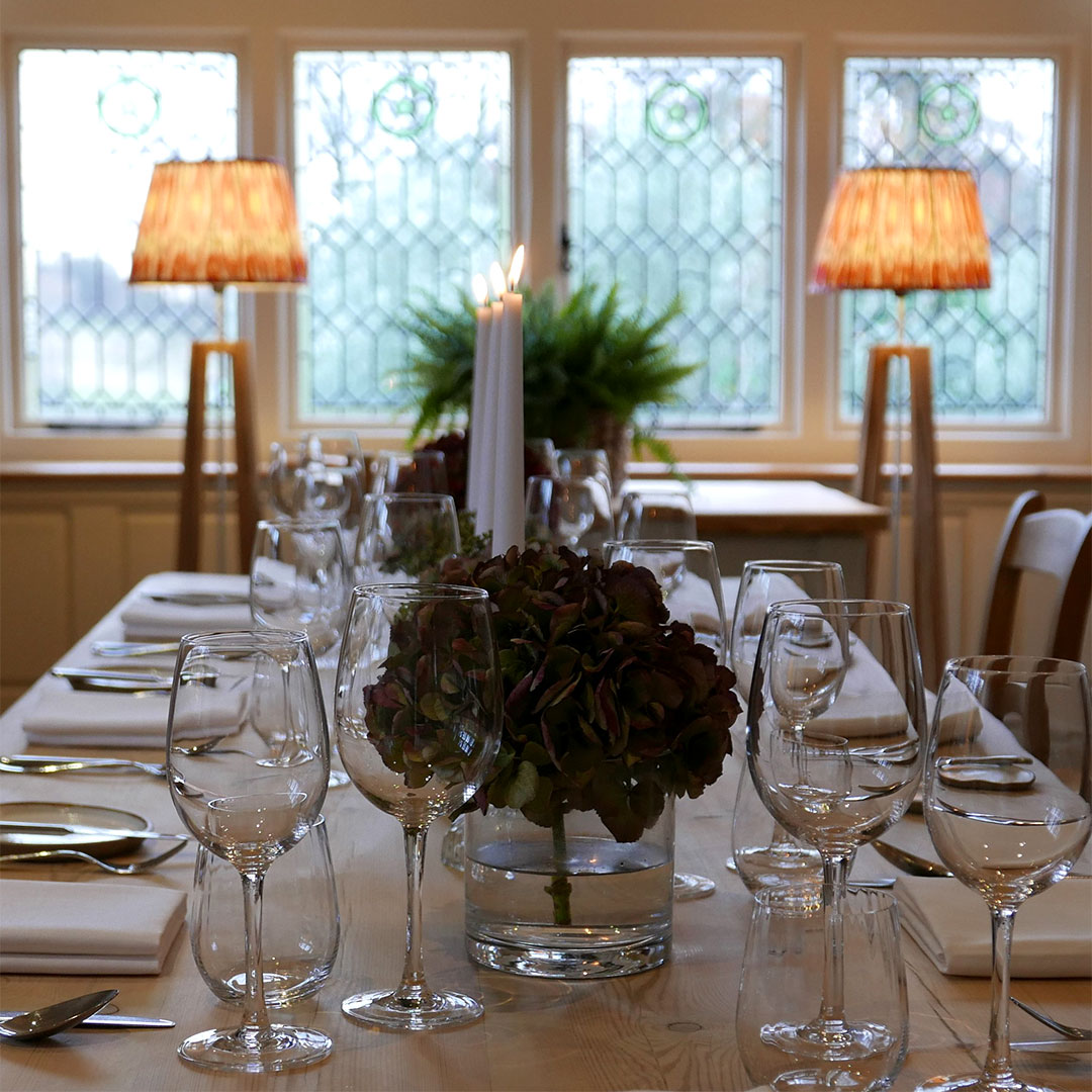 Elegant dining table with glassware and floral centerpiece at Dysart Petersham event venue.