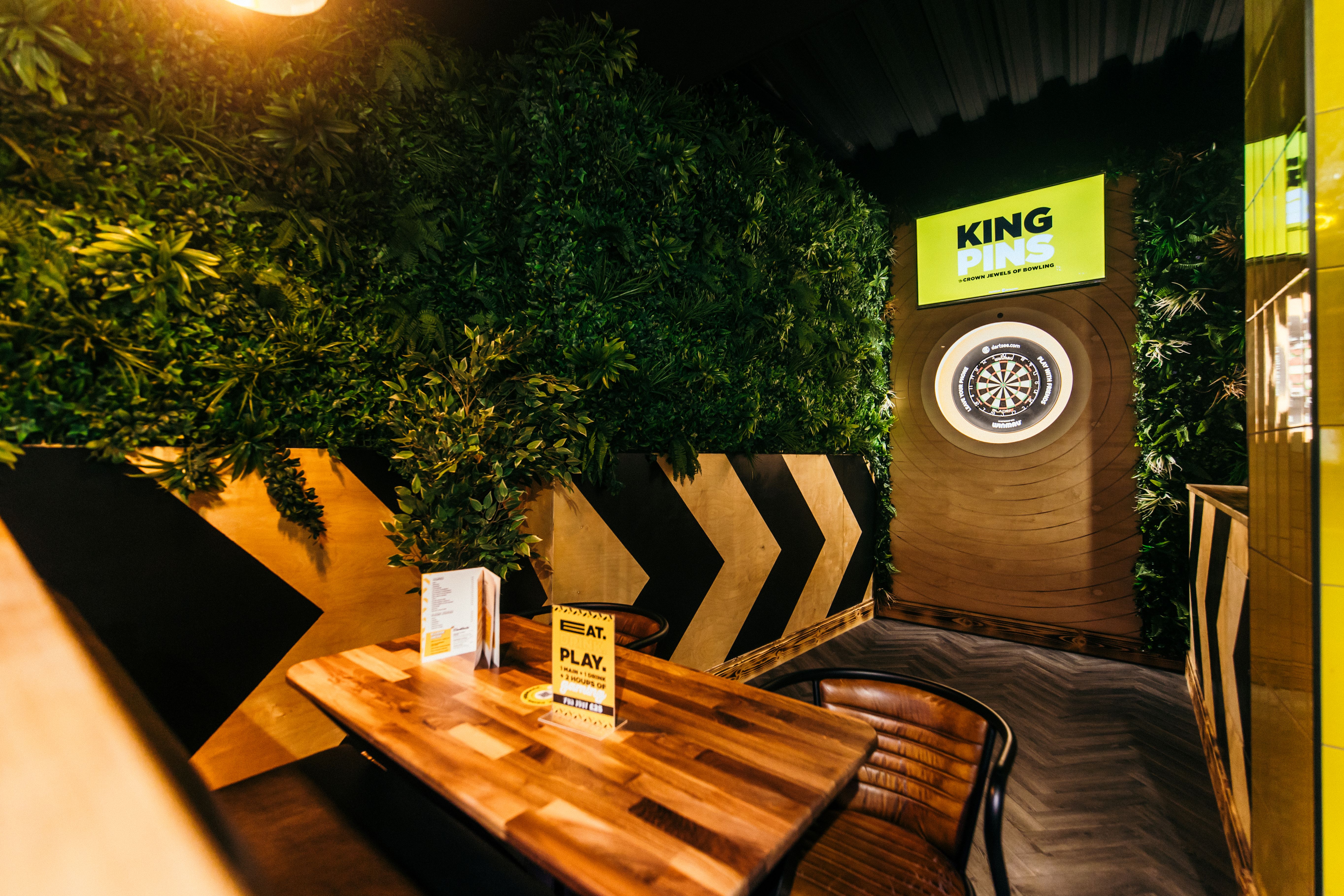Bullseye Zone at King Pins: vibrant green space for corporate team-building events.