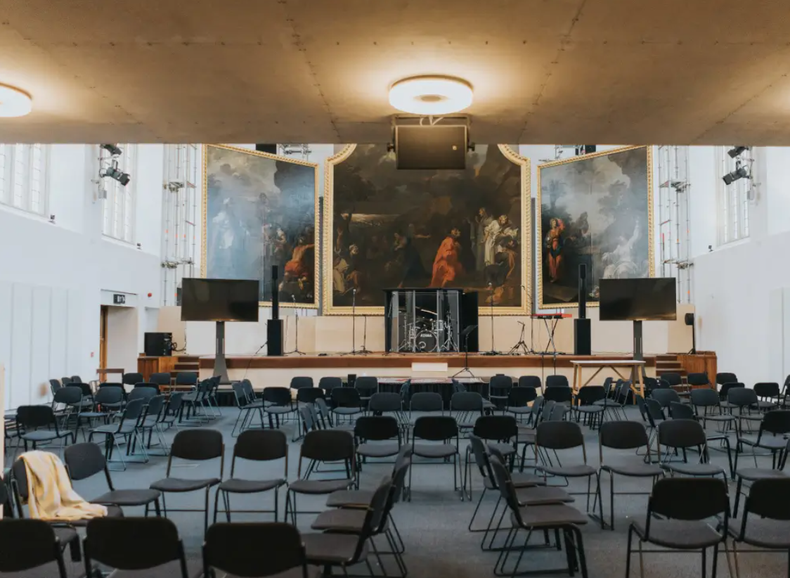 St Nicholas Bristol Nave: spacious event venue for conferences with elegant artwork backdrop.