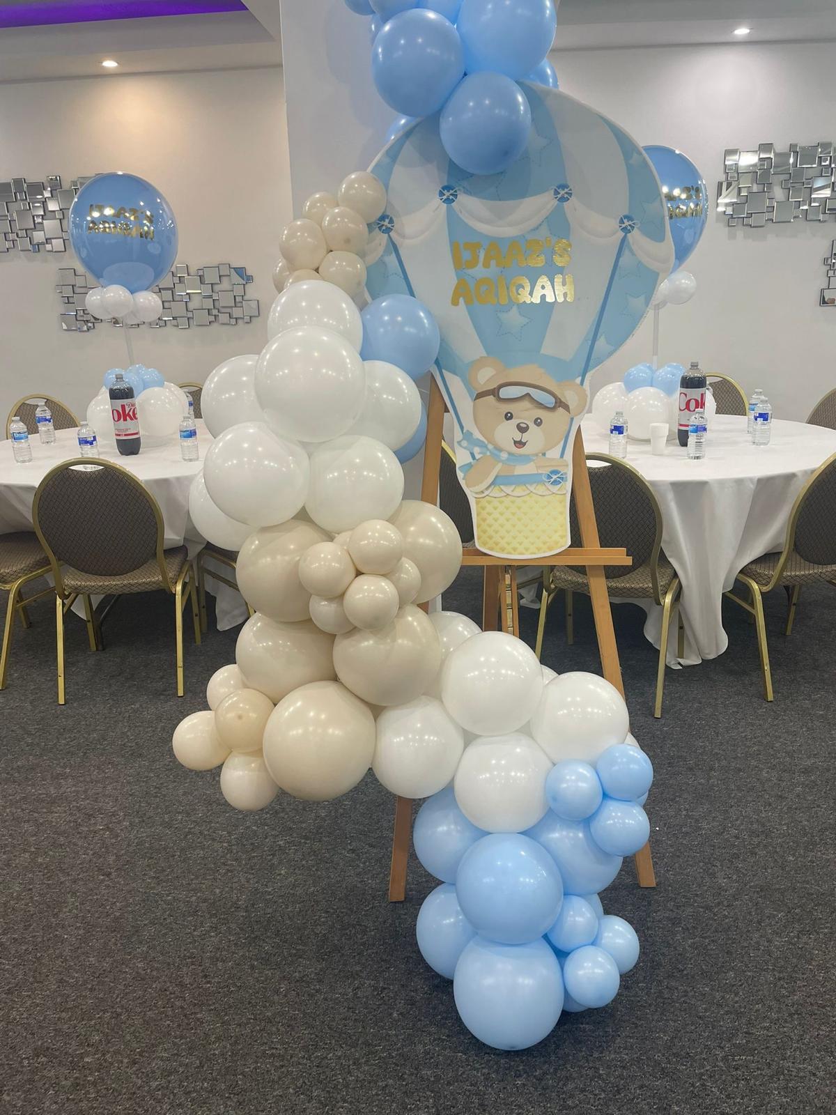 Balloon arrangement and teddy bear decor for a baby shower in Hidden Space Function Hall.