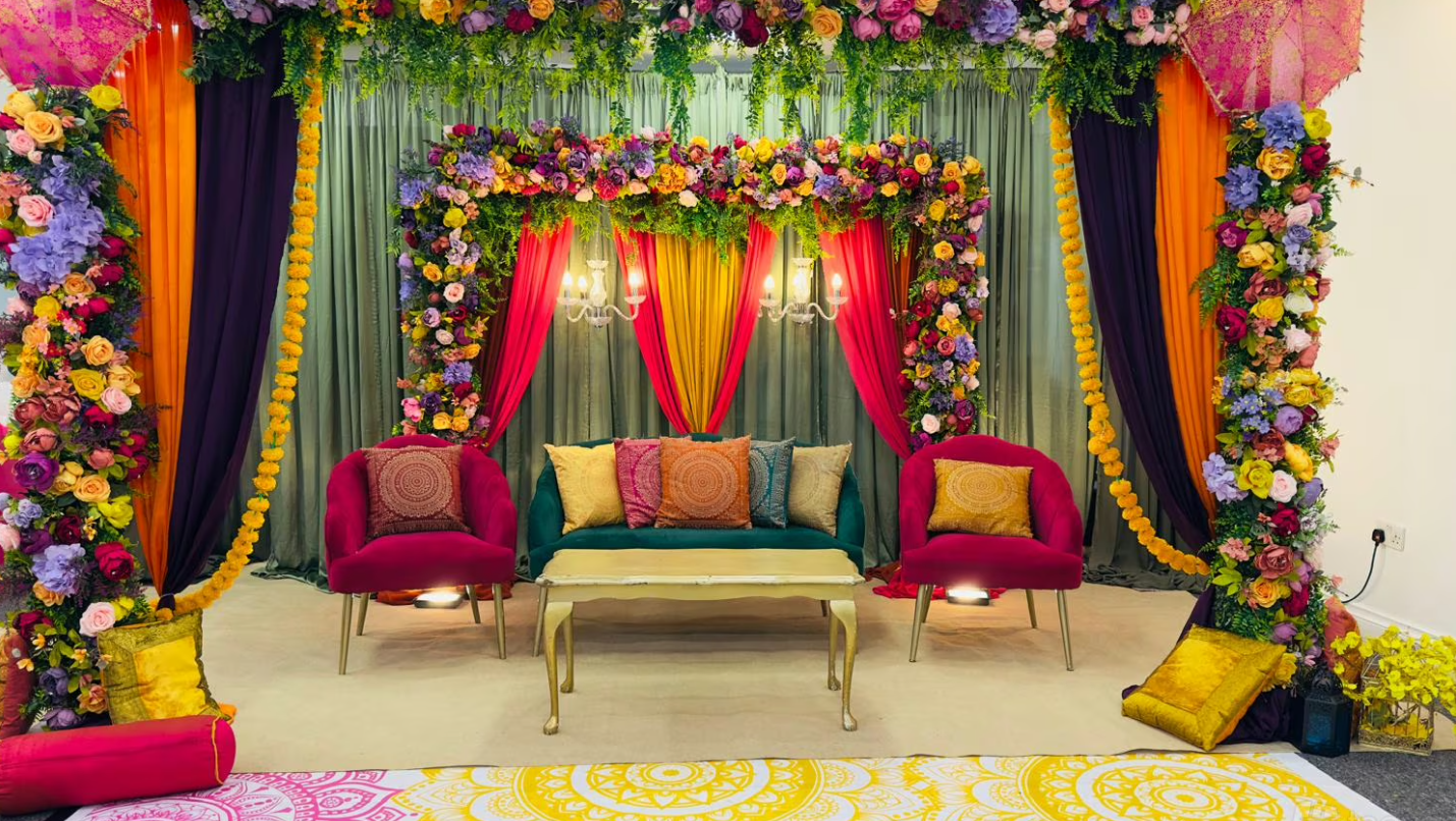 Vibrant floral-decorated wedding venue with plush seating in Hidden Space Function Hall