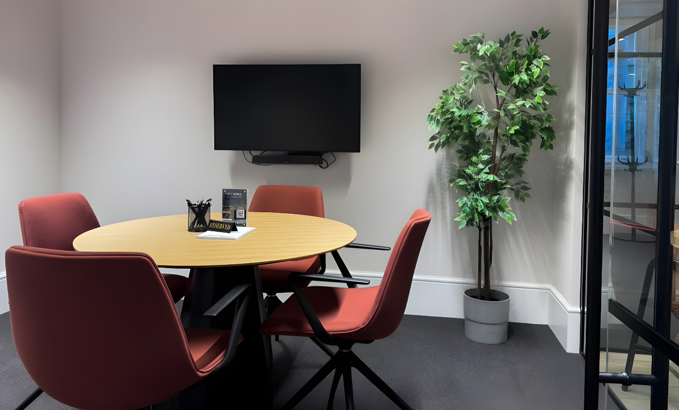 Fitzroy meeting room with round table, ergonomic chairs for effective collaboration.