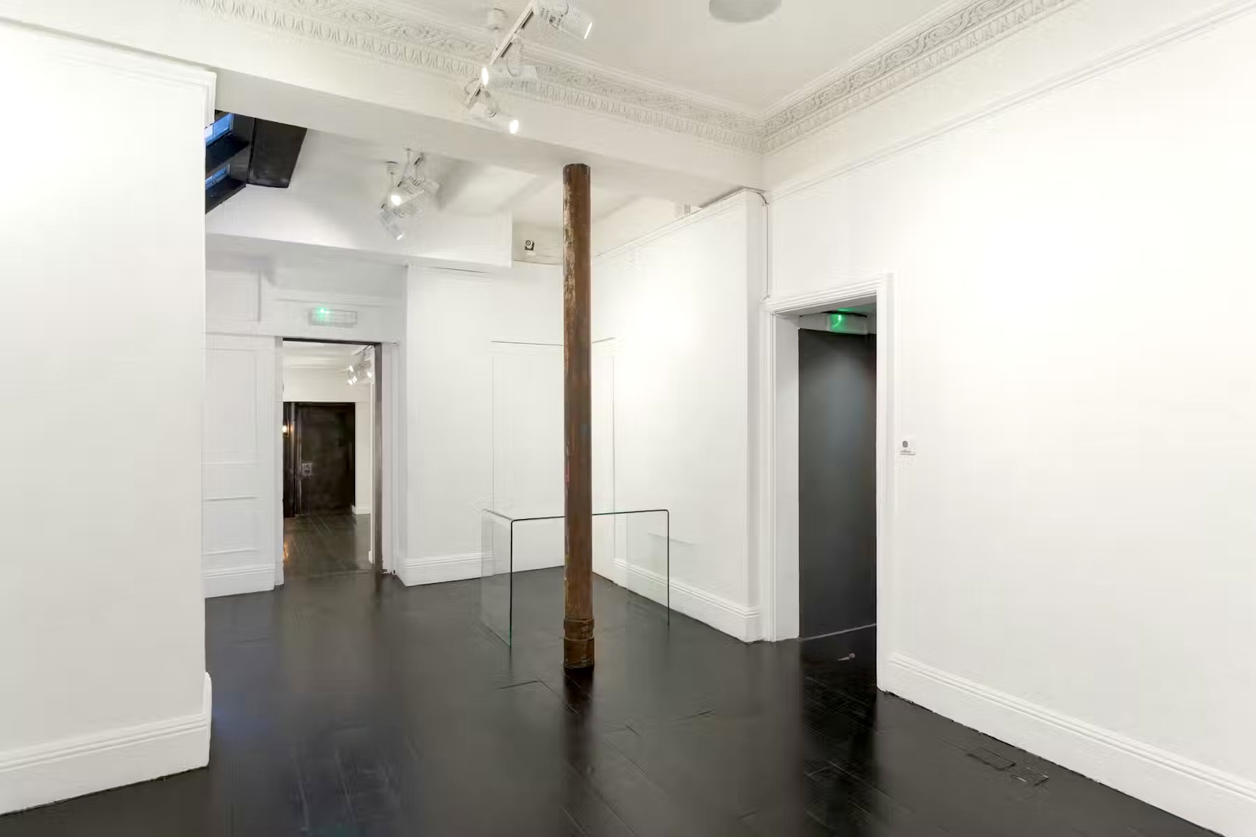 Minimalist gallery at 15 Bateman Street Soho with polished floors; perfect for events.