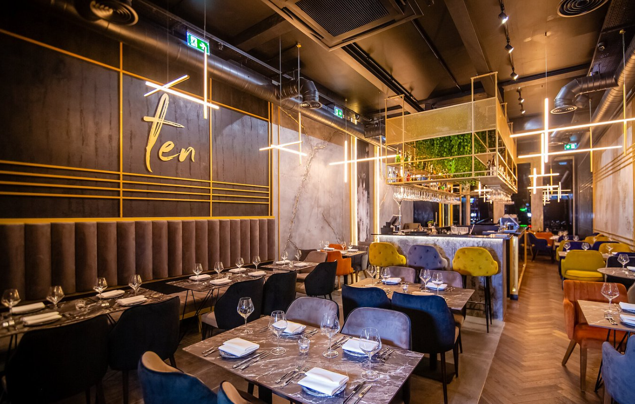 Modern upscale restaurant with elegant decor, ideal for corporate events and celebrations.