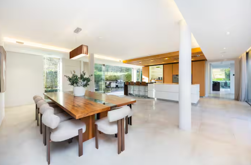 Modern Radlett Eco Mansion venue with wooden dining table for intimate meetings and events.