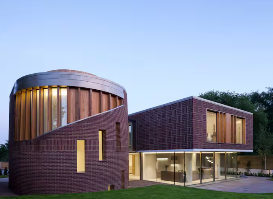 Contemporary Radlett Eco Mansion venue with brick and glass design for creative events.