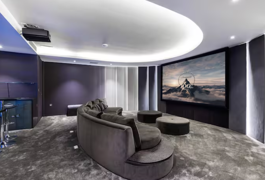 Modern meeting space at Radlett Eco Mansion with curved seating, perfect for team retreats.