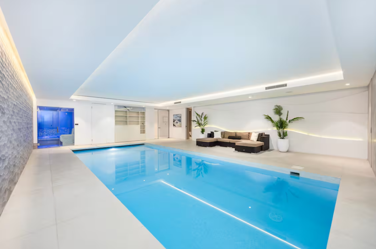 Upscale indoor pool at Radlett Eco Mansion, perfect for wellness retreats and gatherings.