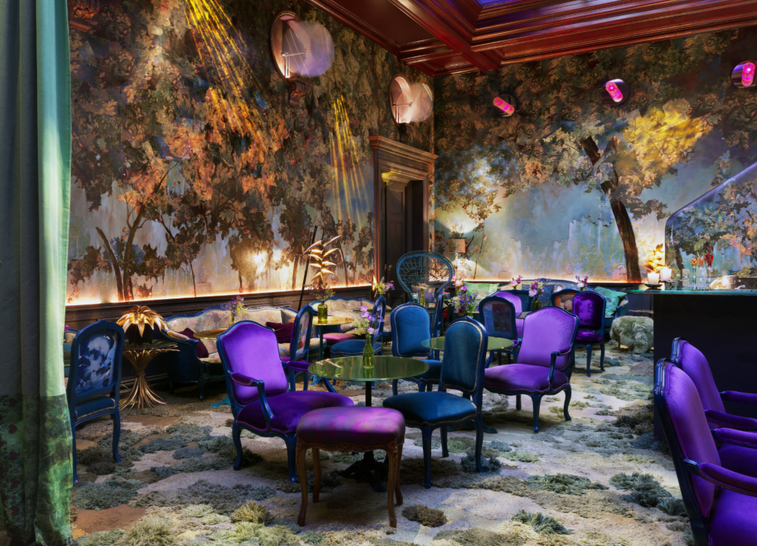 Luxurious event space with vibrant mural, ideal for upscale gatherings and meetings.