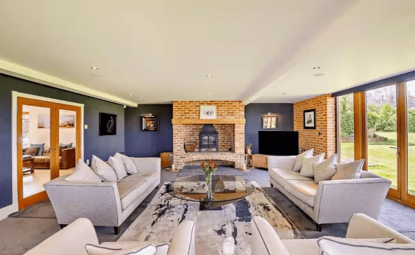 Modern meeting space with a cozy fireplace, ideal for brainstorming sessions and workshops.