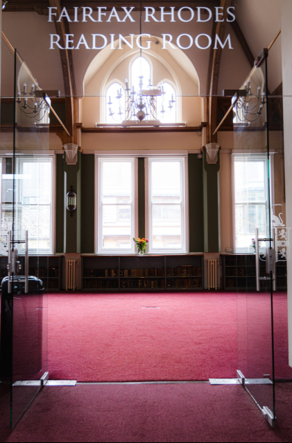 Keynes Library event space with large windows and rich red carpet for corporate gatherings.