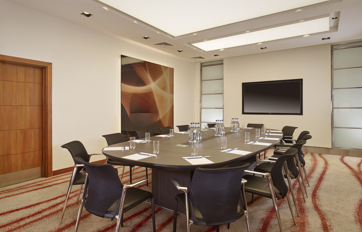 Executive Boardroom at Park Plaza Victoria London, modern conference room with oval table.