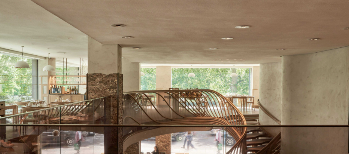 Modern event venue Mezzanine in Hide with a wooden staircase, ideal for meetings and gatherings.