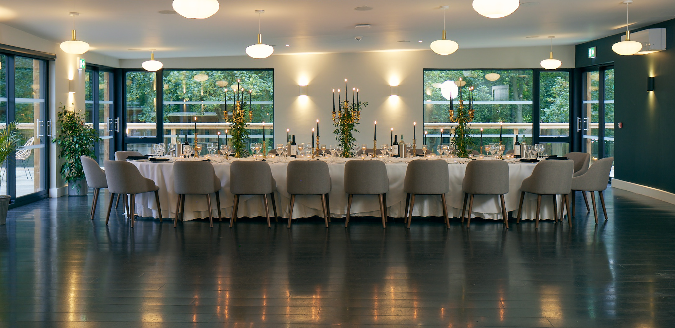 Elegant banquet table in modern venue for intimate gatherings or corporate events.