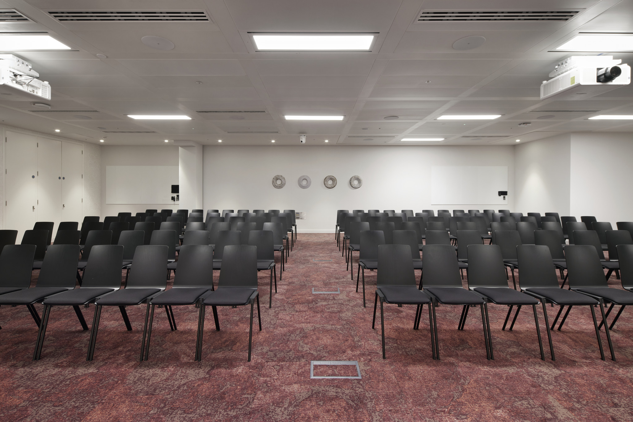 Bon Hub meeting space with black chairs, perfect for professional presentations and workshops.