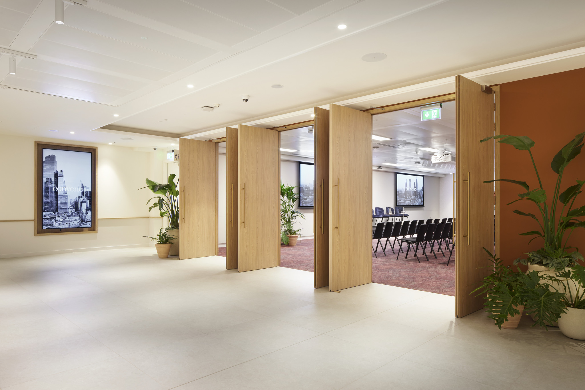 Bon Hub meeting space at Convene 200 Aldersgate with wooden doors, perfect for conferences.