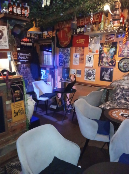 Cozy venue with vibrant art, perfect for informal meetings and social gatherings.