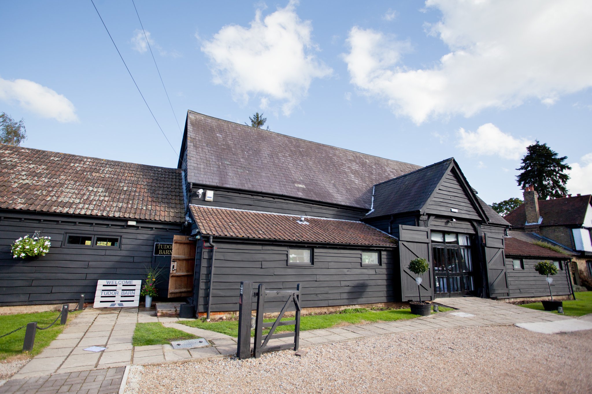 Whole Venue at Tudor Barn, rustic black exterior, ideal for corporate retreats and gatherings.