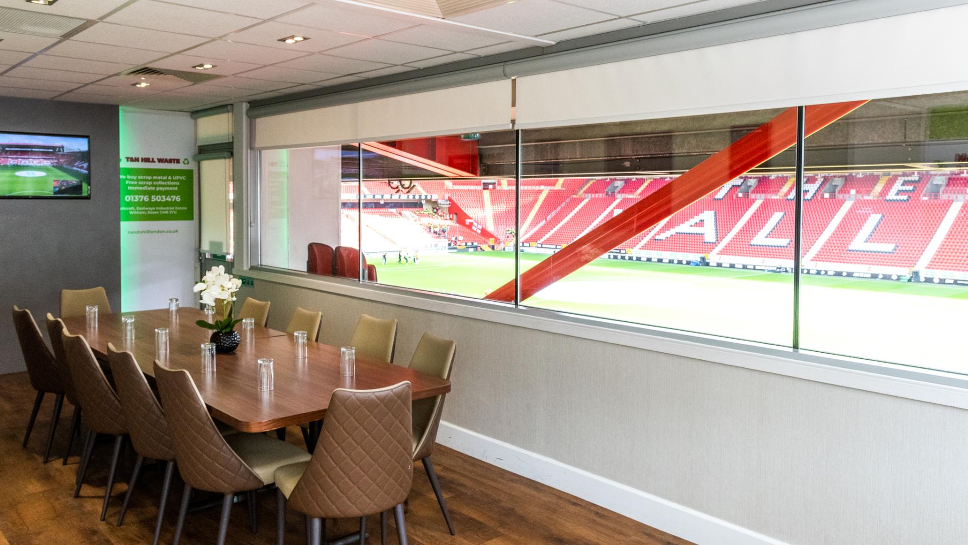 Boardroom at Charlton Athletic with a large table, ideal for corporate events.