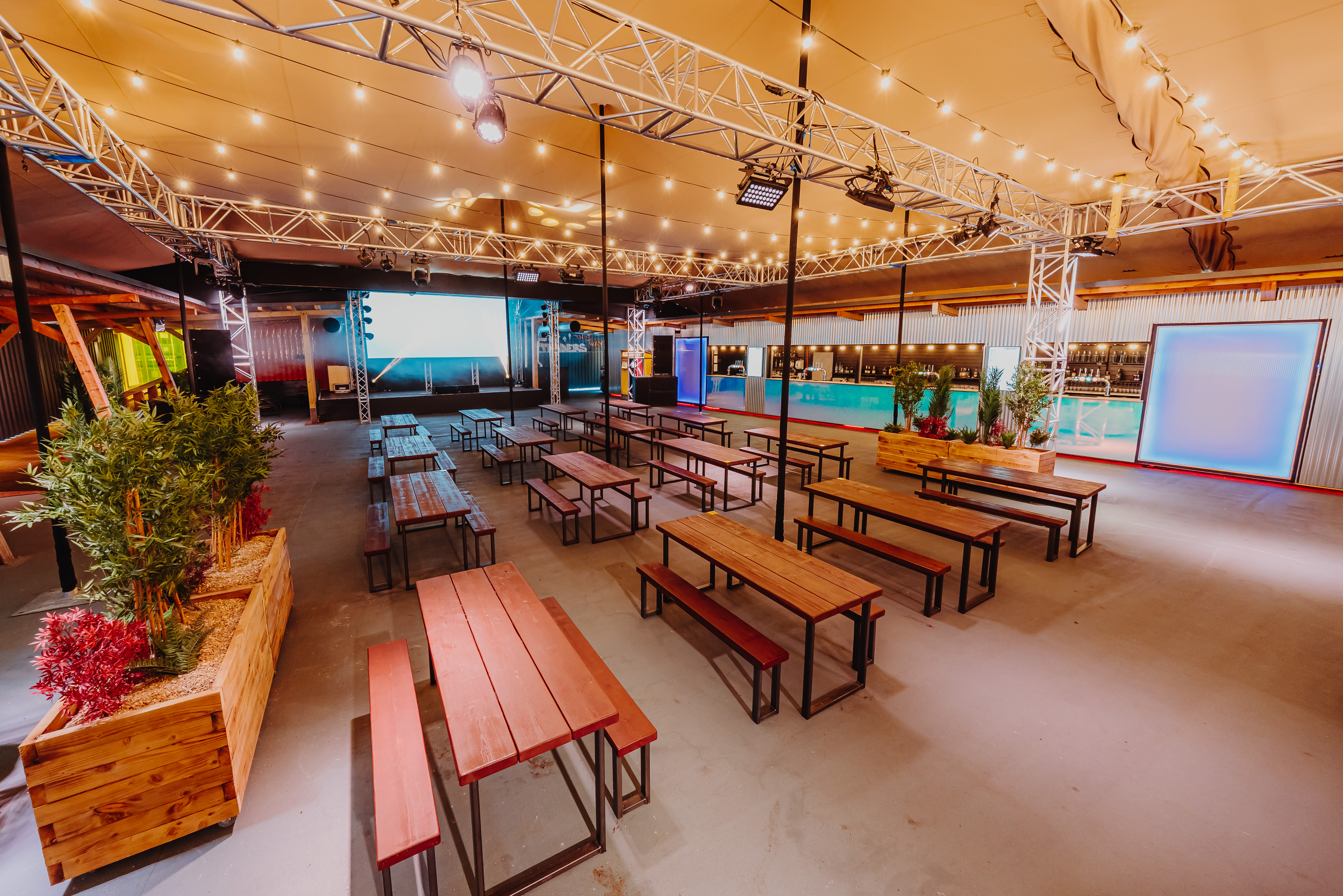 Industrial event space at Freight Brixton with string lighting for networking and dinner parties.