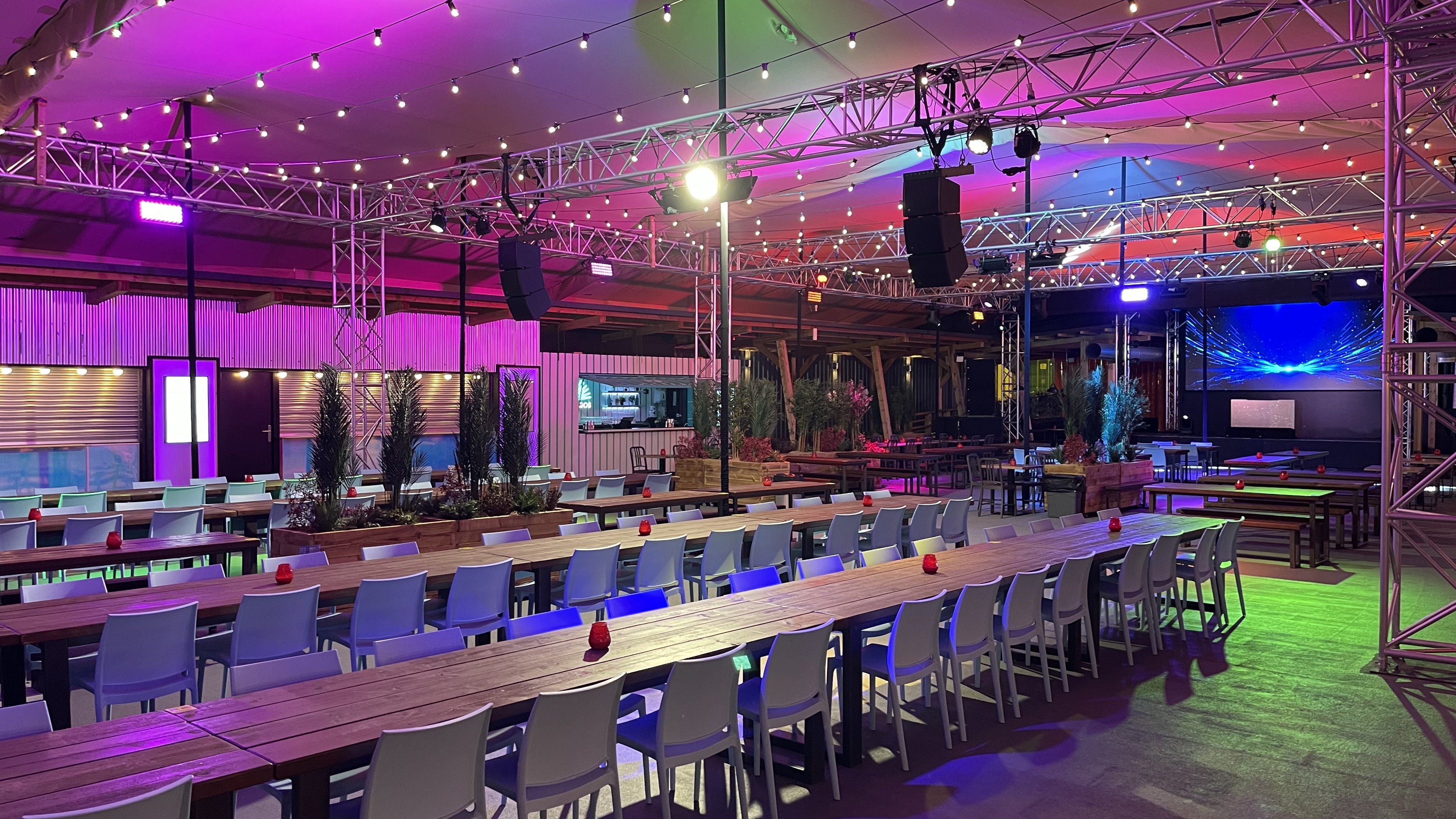 Versatile event space with dining tables in Freight Brixton for gatherings and presentations.