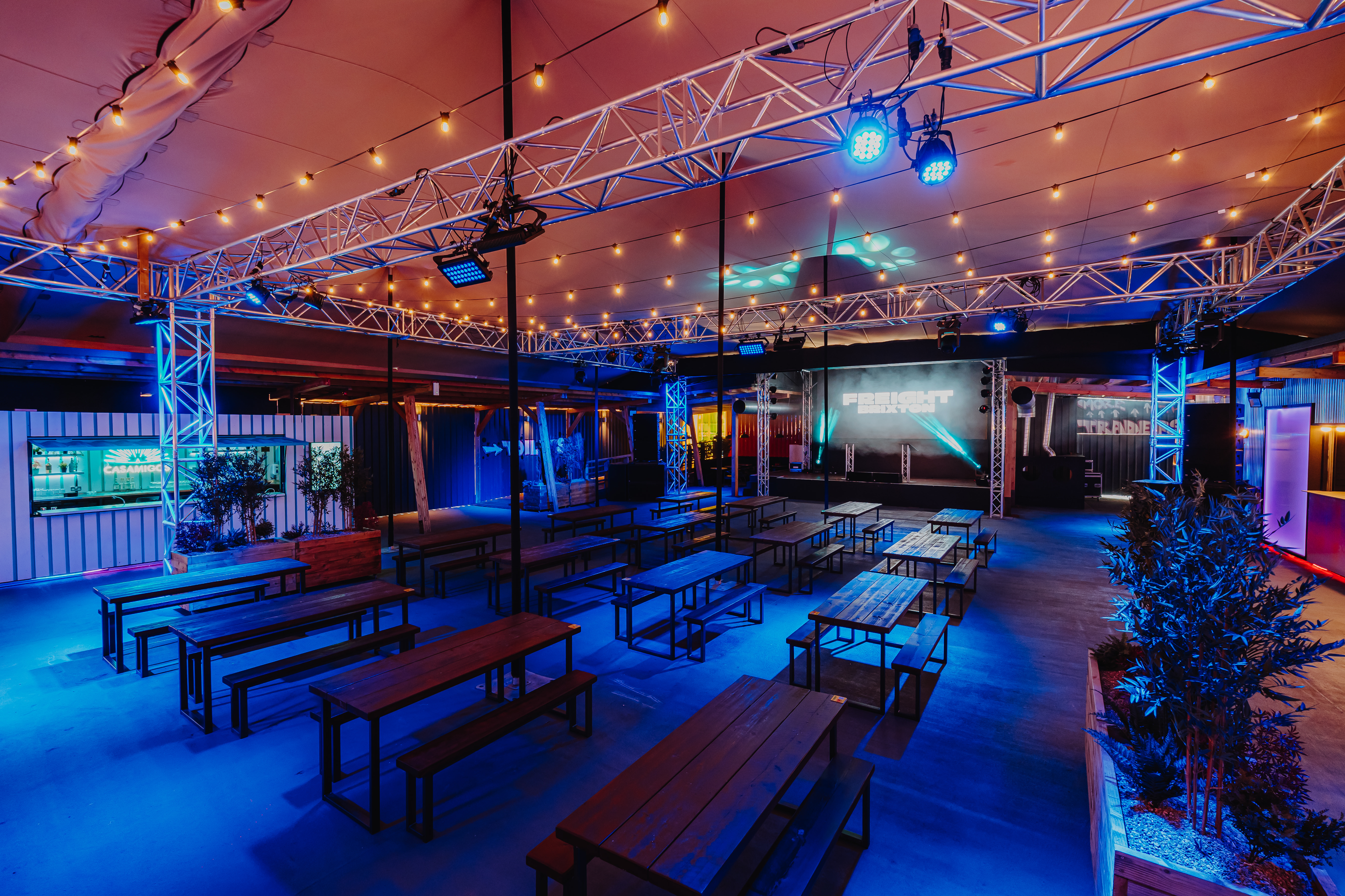 Industrial-chic event space with modular seating for networking and corporate activations.