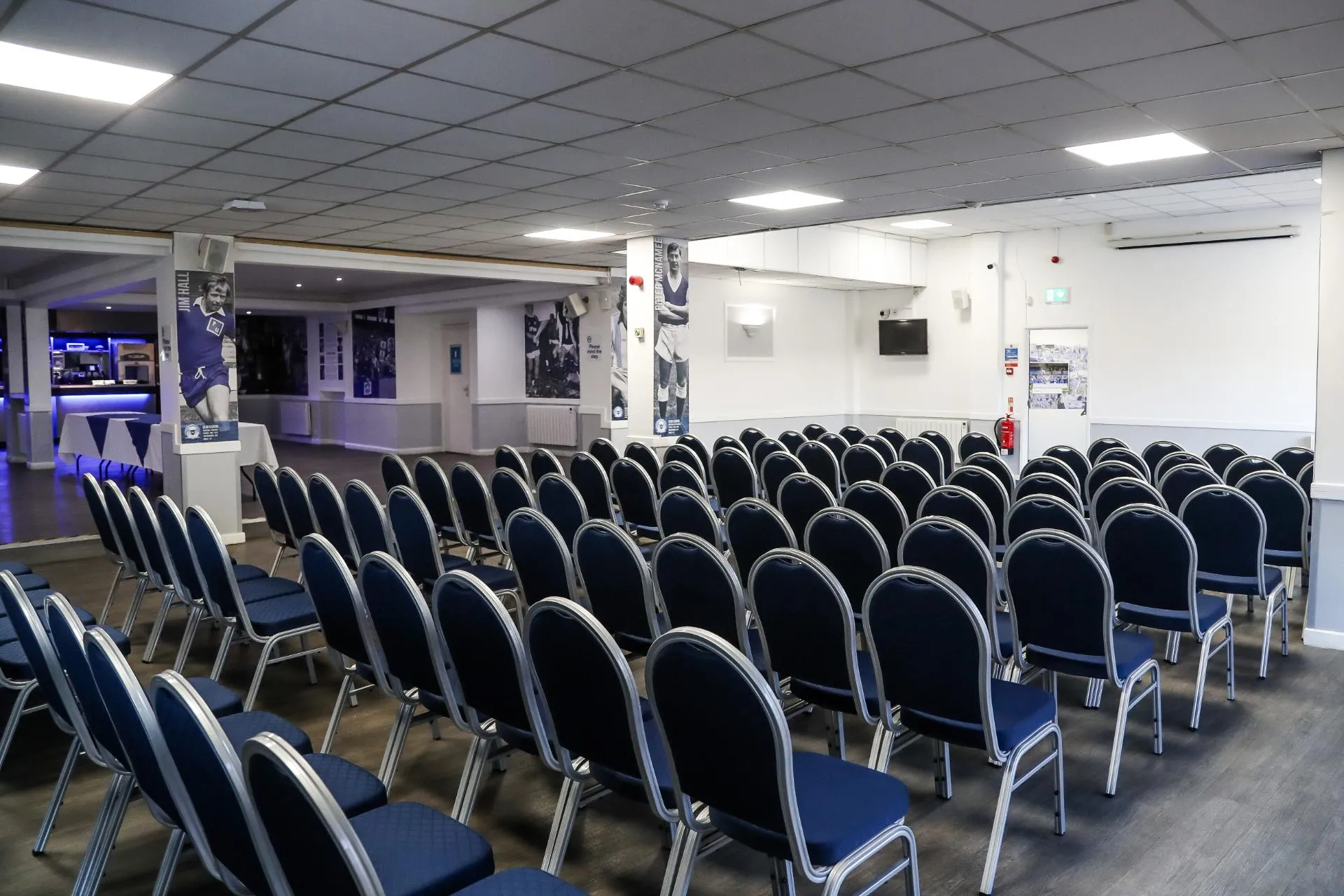 Executive Suite at Peterborough United FC with navy blue chairs, perfect for conferences and meetings.