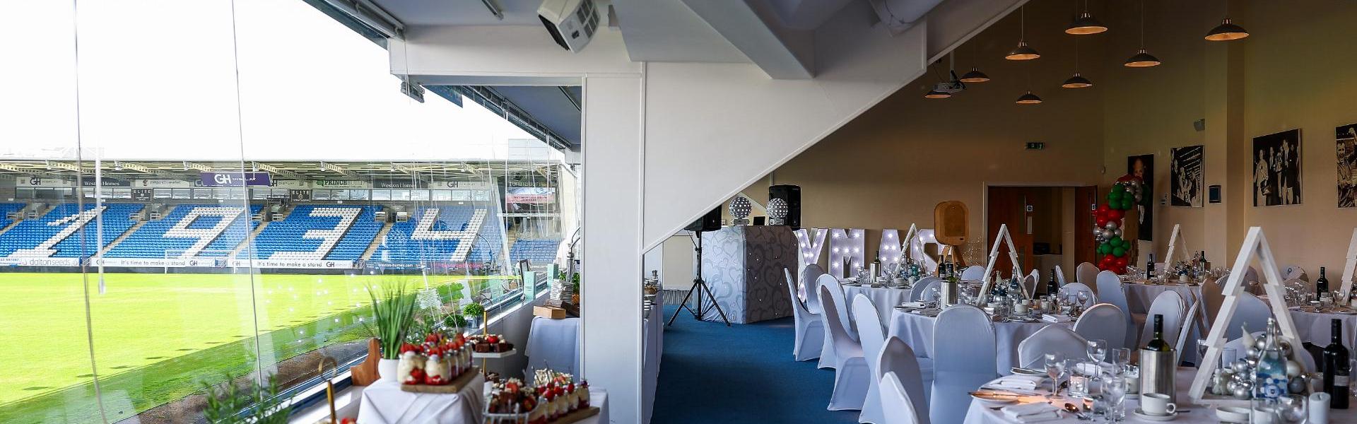 Noel Cantwell Suite at Peterborough United FC, elegant corporate event space with field view.