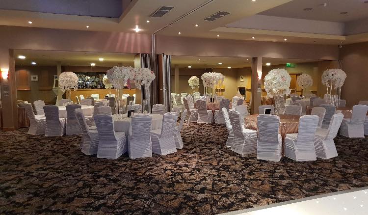 Elegant Sauvignon suite with tall centerpieces, ideal for weddings and formal events.