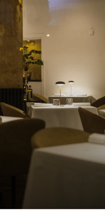 Elegant dining setup at Amâlia Restaurant for corporate meetings and intimate events.