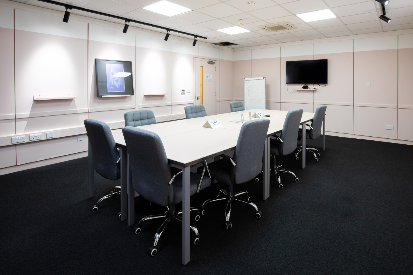 Salisbury Room meeting space with ergonomic chairs for strategic discussions and presentations